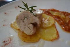 Chicken on flower of potatoes with yellow tomato sauce